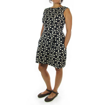 Woman modeling black and white day dress