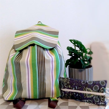 Rucksack backpack and zipper pouch on table